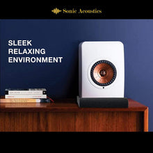 Load image into Gallery viewer, a speaker on a shelf with text: 'Sonic Acoustics SLEEK RELAXING ENVIRONMENT .......'
