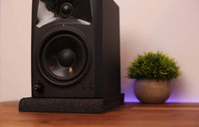 Load image into Gallery viewer, a black speaker on a wood surface