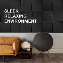 Load image into Gallery viewer, a couch and a round object in front of a wall with text: 'SLEEK RELAXING ENVIRONMENT'