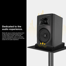 Load image into Gallery viewer, a black speaker on a stand with text: 'Dedicated to the audio experience. Made with easy-to-install polyurethane foam to help improve the sound output of your in-home studio or home. This will help minimize reverberation, echo, or any other by-products of sound so you can stay locked into the audio experience.'
