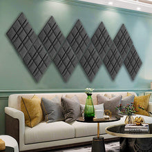 Load image into Gallery viewer, a room with a couch and a coffee table with text: 'CHANEL'