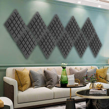 Load image into Gallery viewer, a room with a couch and a coffee table with text: 'CHANEL'