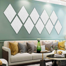 Load image into Gallery viewer, a room with a couch and a coffee table with text: 'CHANEL'