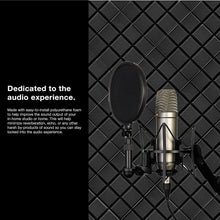 Load image into Gallery viewer, a microphone and a microphone on a stand with text: 'Dedicated to the audio experience. Made with easy-to-install polyurethane foam to help improve the sound output of your in-home studio or home. This will help minimize reverberation, echo, or any other harsh by-products of sound so you can stay locked into the audio experience.'
