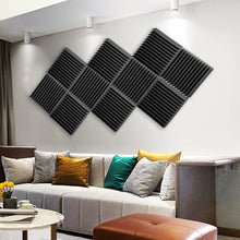 Load image into Gallery viewer, a room with a couch and a wall art
